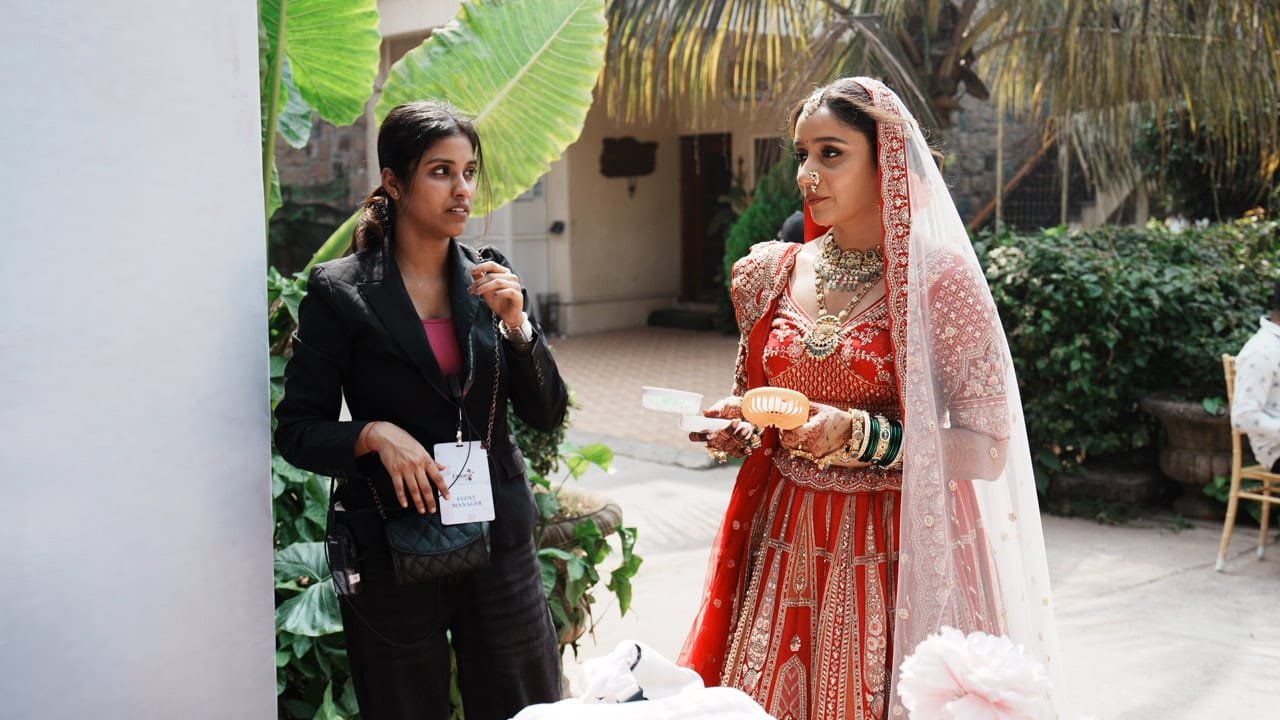 Event manager assisting the bride